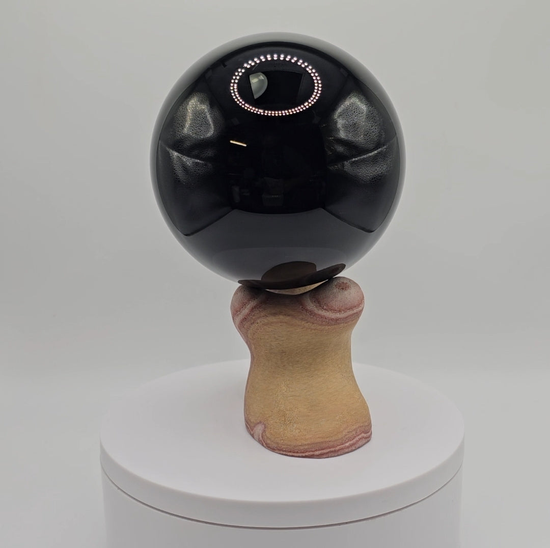 Handcarved sphere stand