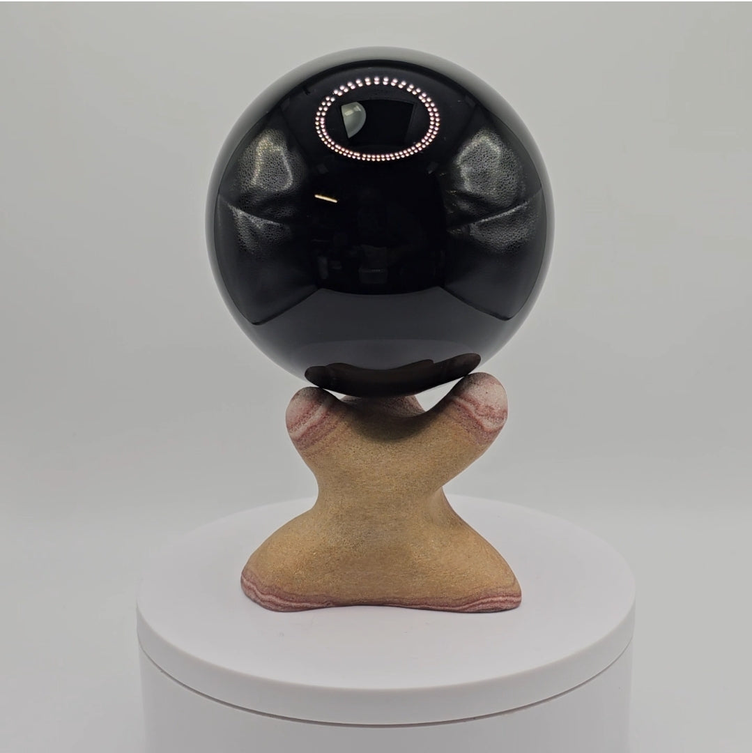Handcarved sphere stand